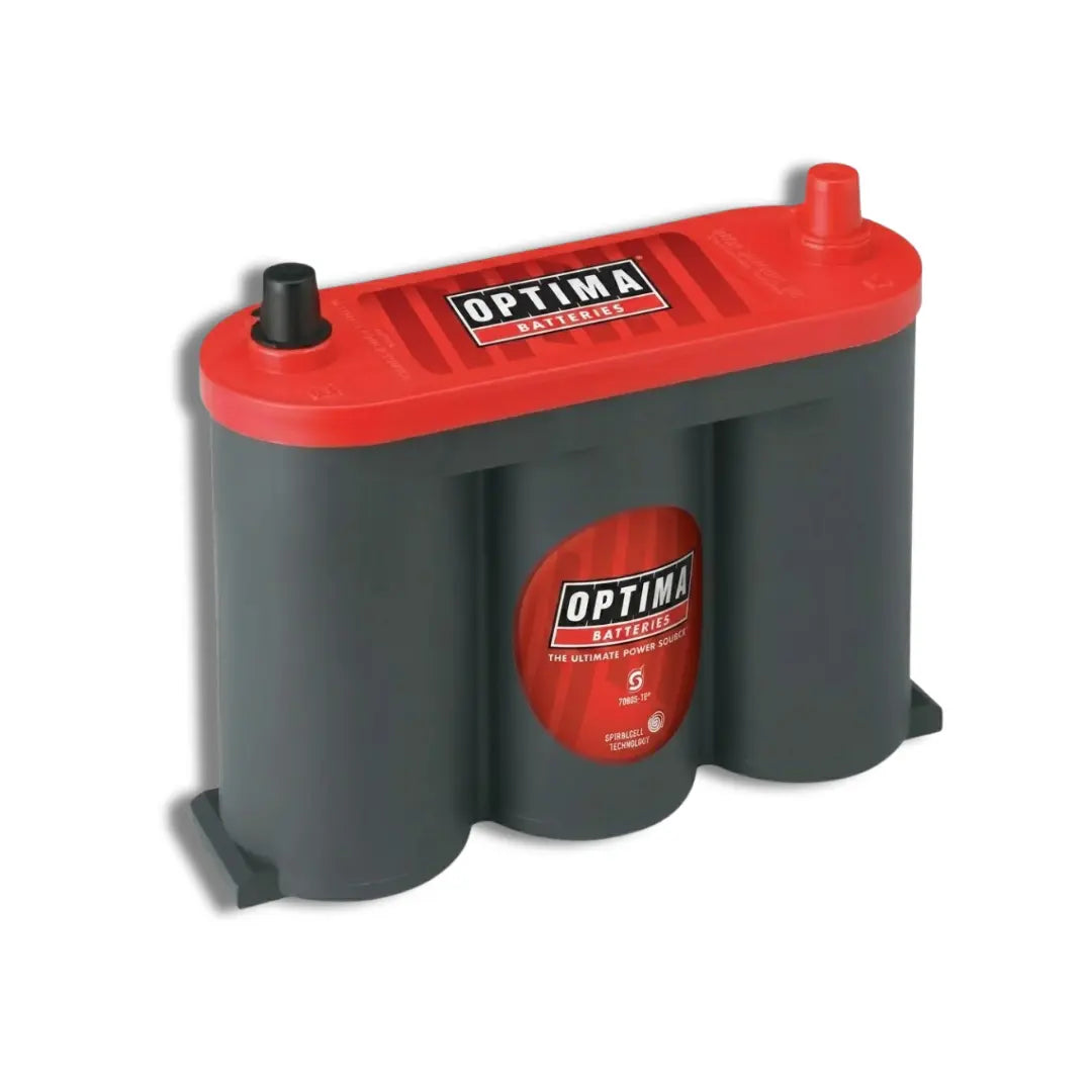 An Optima 6V-1050 50Ah battery with a red top cover and dark gray cylindrical cells, shown on a plain white background.