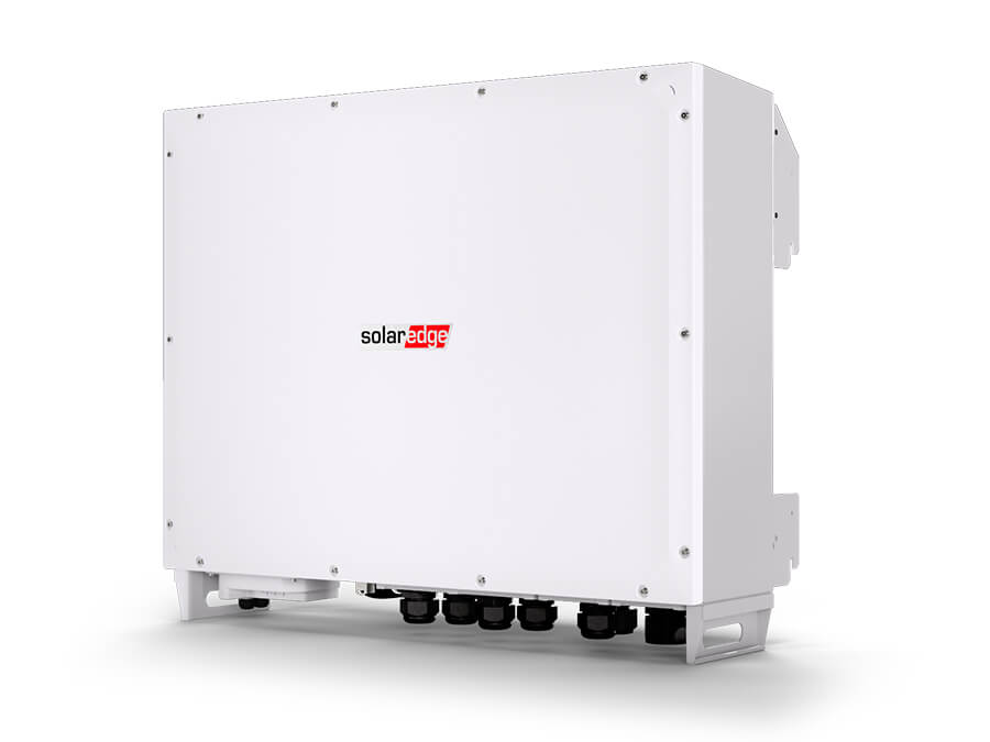 A white SolarEdge solar inverter system with a red and black logo on the front, shown at a three-quarter angle on a clean white background.