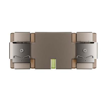 A top-down view of a modern rectangular electronic device, likely a power bank or charging device, featuring a metallic bronze and silver finish with a small green indicator light in the center, set against a plain white background.