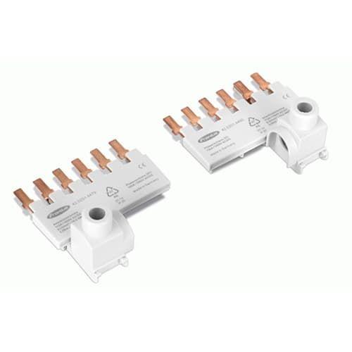 Two white plastic electrical connector blocks with copper-colored terminal posts, shown on a plain white background.