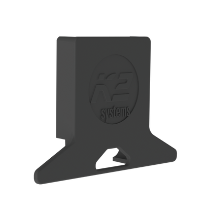 K2 Systems 4000250 MiniRail Polyamide Rail End Cap a matte black plastic or rubber mounting bracket with a circular embossed logo reading 'K2 systems' on the front face, shown on a plain white background.