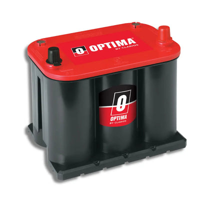 A heavy-duty automotive battery with a red top cover and black cylindrical cells, featuring the 'Optima by Clarion' logo on the front and top.