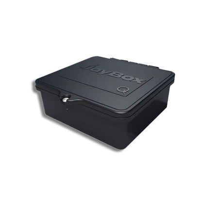 A high-resolution product image of the QM-JBX-RF01-B1 (QuickMount JayBox), featuring a durable black, UV-resistant plastic junction box designed for rail-mounted solar applications. The unit features a hinged lid with the "JayBox" logo and a single-screw locking mechanism to ensure a watertight seal for DC string transitions on residential PV arrays.