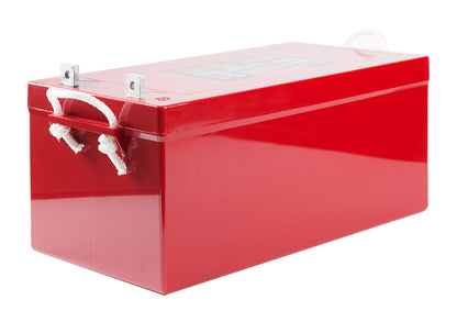 A red rectangular battery with white rope handles and metal terminal caps, shown on a plain white background.