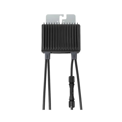 A black rectangular electronic module with a ribbed heat sink, a gray mounting tab on top, and three black cables extending downward, including one with a connector, shown on a plain white background.