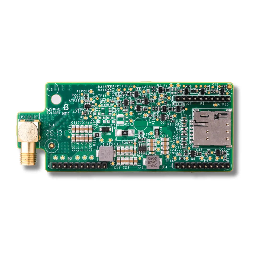 A green electronic circuit board with various electronic components, a gold-plated SMA connector on the left, and an SD card slot on the right, photographed on a clean white background.