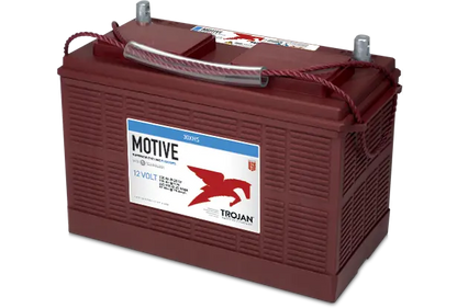 A red Trojan Motive flooded lead acid battery with branding and product information printed on the side.