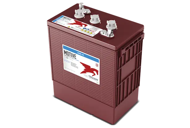 A red Trojan Motive flooded lead acid battery with visible terminals and branding on the top.