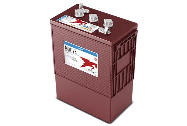 A red Trojan brand flooded lead acid battery with visible branding, gauges, and handles on the top.