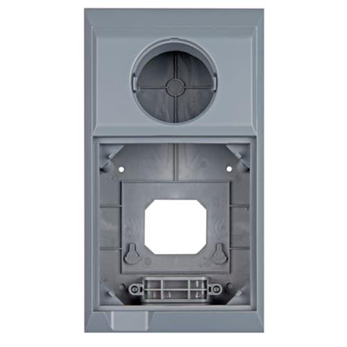 A gray wall mount enclosure with a circular opening at the top and a larger rectangular cutout with mounting points below, shown on a plain white background. 